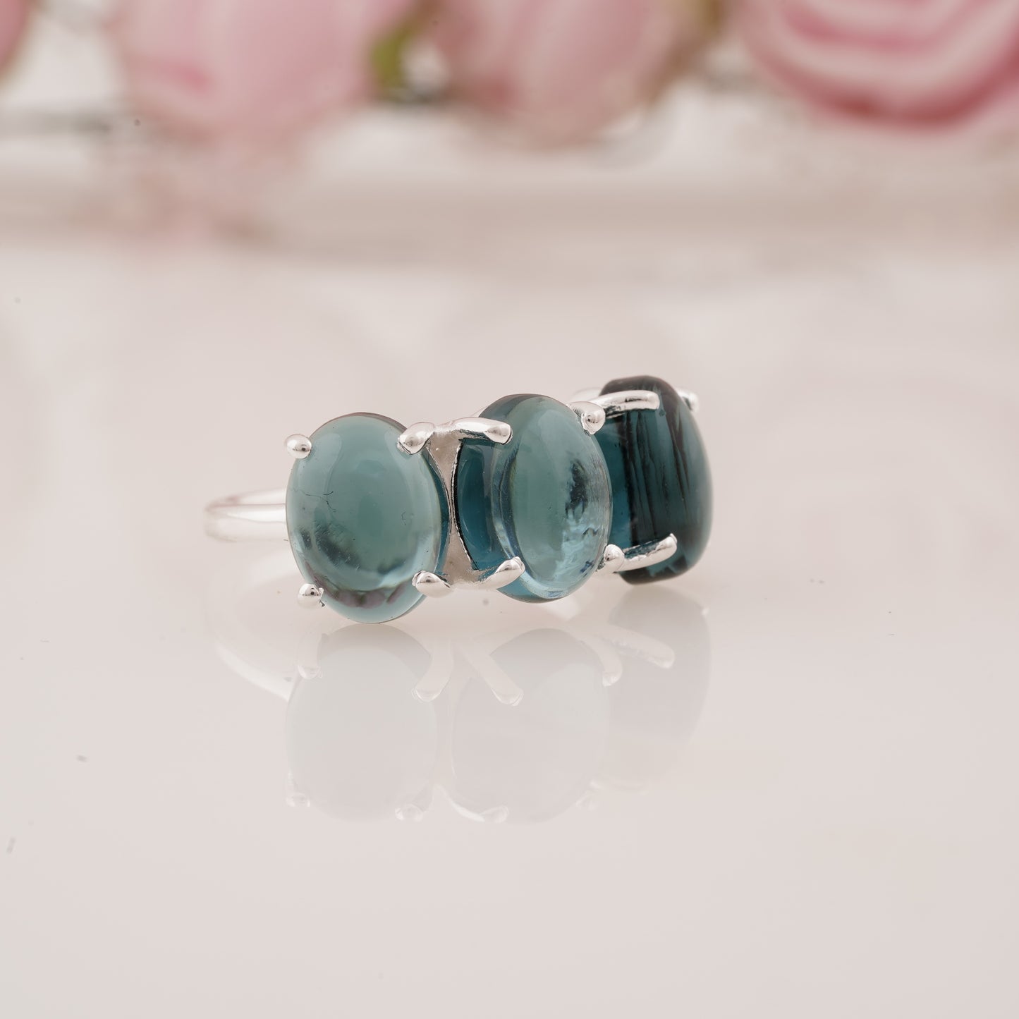 Elegant Lab-Grown Oval Shape Blue Topaz Three Stone Ring