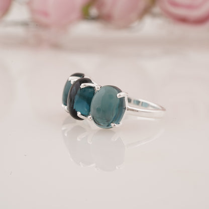 Elegant Lab-Grown Oval Shape Blue Topaz Three Stone Ring