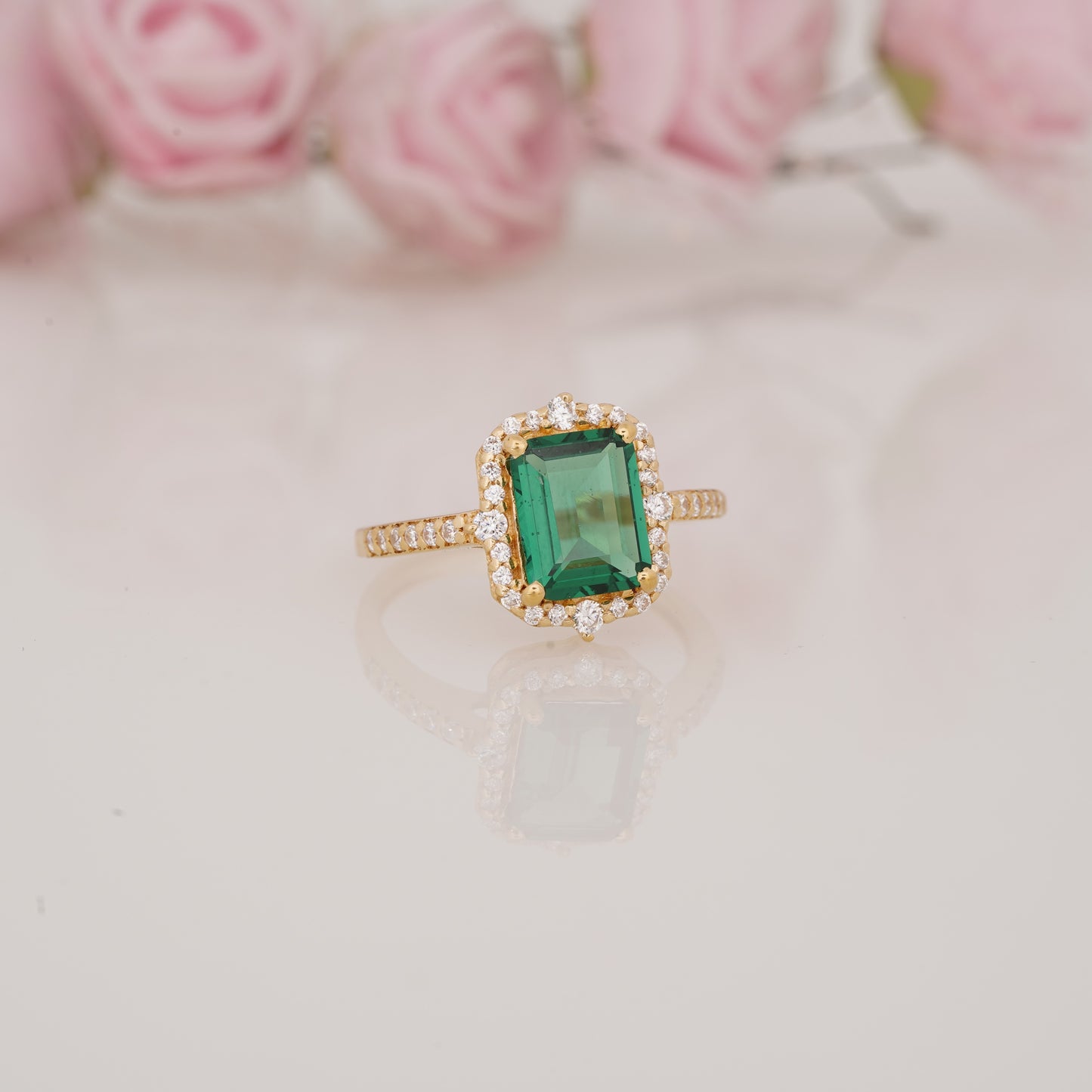 Halo-Style Engagement Ring with Emerald-Cut Emerald Stone and Moissanite Side Stones
