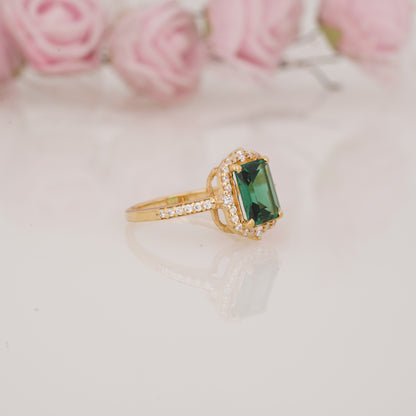 Halo-Style Engagement Ring with Emerald-Cut Emerald Stone and Moissanite Side Stones