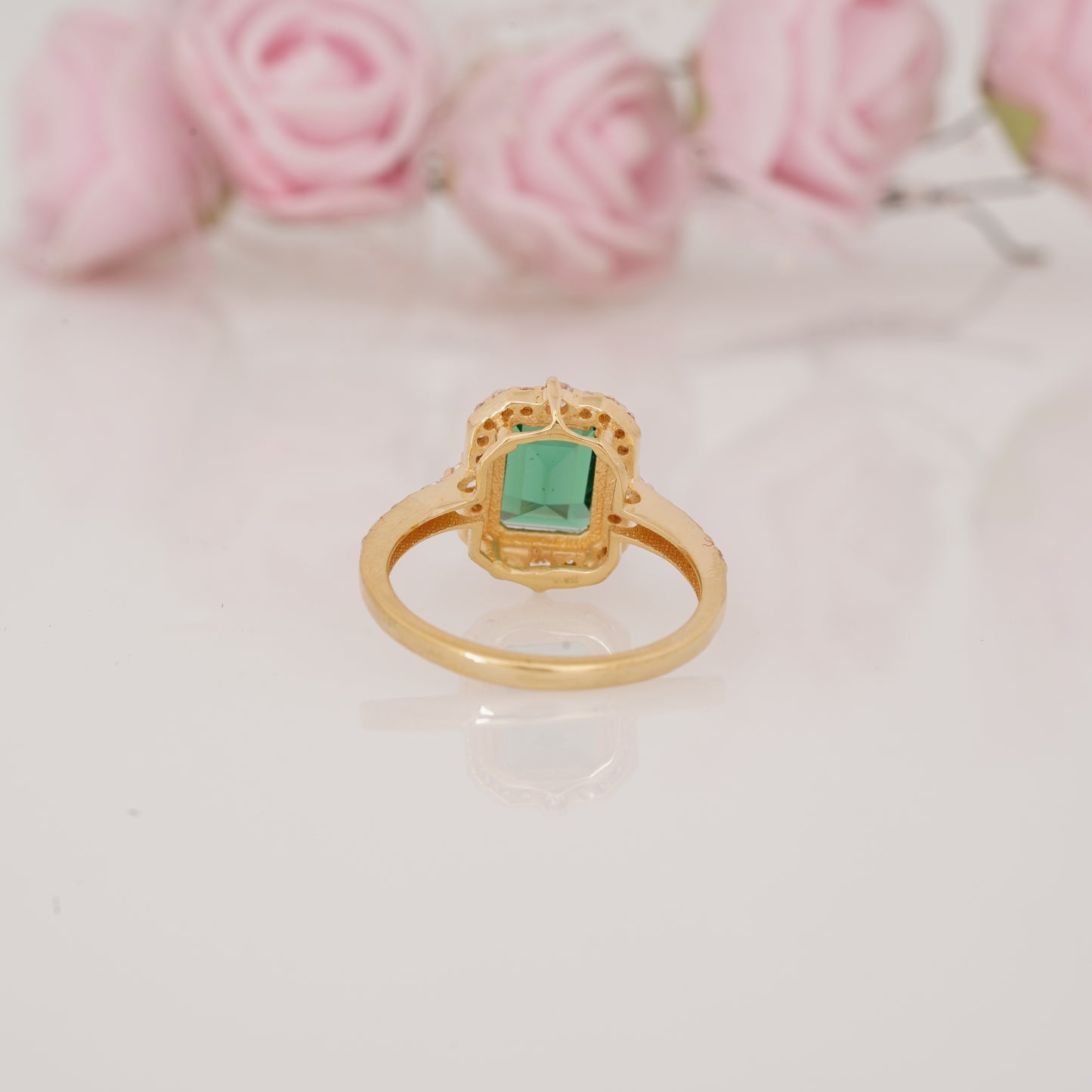 Halo-Style Engagement Ring with Emerald-Cut Emerald Stone and Moissanite Side Stones