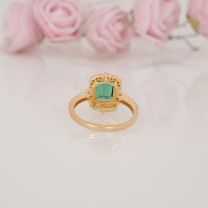 Halo-Style Engagement Ring with Emerald-Cut Emerald Stone and Moissanite Side Stones