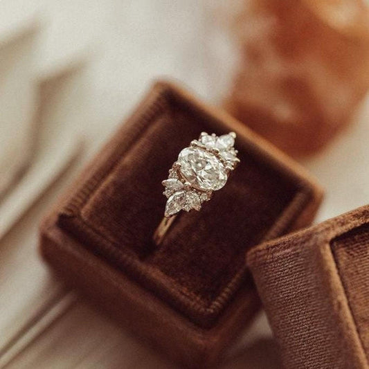 Lab Grown Oval Moissanite and Side Marquise Cluster Engagement Ring