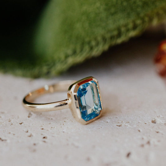 Lab-Grown Emerald-Cut Swiss Blue Topaz Solitaire Ring